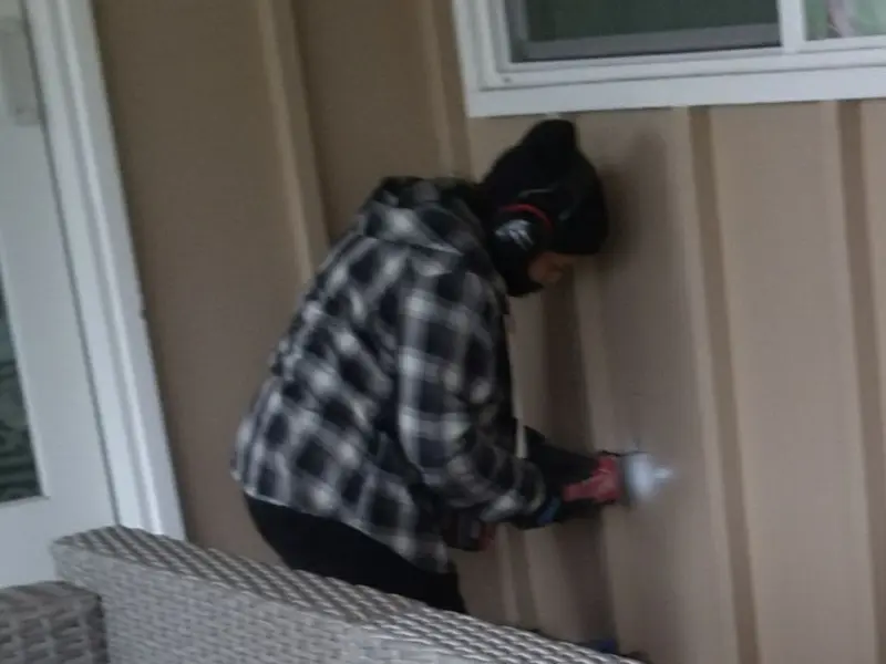 Professional electrician installing an exterior outlet in Chester